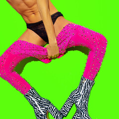 Fashion sexy girl in heel party zebra boots and pink leggins down on green minimal background....