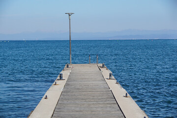 Fototapeta na wymiar Pier in the sea . jetty over the beautiful sea with blue sky