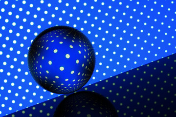 glass ball on an abstract geometric background