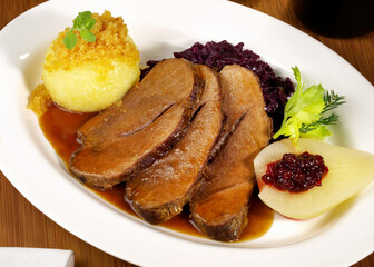 Wild Boar Roast with Potato Dumpling and red Cabbage