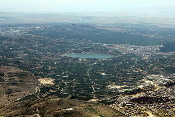 The view of the Syrian's villages Ermeh Durbul & Rima Qatatana, from the Israeli part at the winter of 2019. The hills look like a small one but the air is still smoky, nobody is moving around.