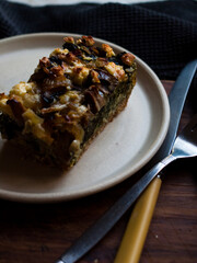 Rustic farmhouse spinach quiche in natural light