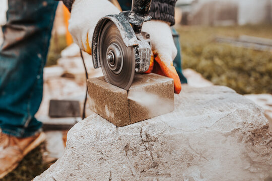 The Diamond Blade Of The Grinder Quickly And Accurately Cuts The Concrete Block - Cutting Stone Tiles For The Sidewalk