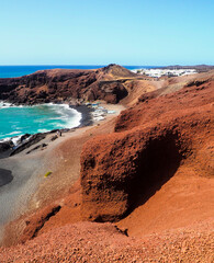 Colorful beach with a village at the back.