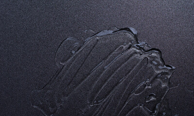 liquid cosmetic gel on gray background