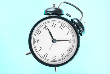 alarm clock on blue