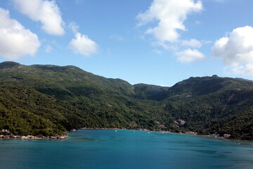 Fototapeta na wymiar The beauty of the port of Labadee in Haiti's iland, clear vision with high mountains with tropical forest present trees and special animals.Dense and evergreen vegetation.