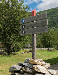 signal indication trails, in tourist town of the Norwegian fjords, wooden sign