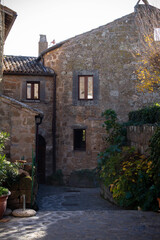 Fototapeta premium Civita di Bagnoregio is one of the most beautiful and characteristic Italian villages with corner of a quaint hill town, tiny alleys with the typical low-rise houses,typical of Medieval architecture.
