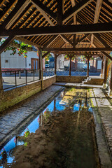 Bernay city Historic traditional washhouse alongside river in Normandy, France