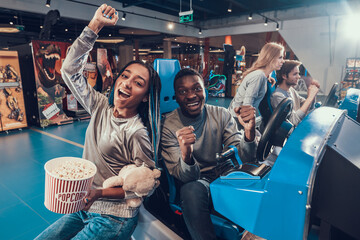 Black woman and man in an entertainment center. 