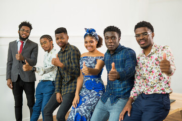 group of young african people in office with hand gesture