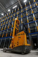 Forklift loader in new empty modern storehouse. Wide angle