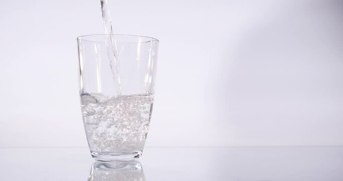 Water pouring into glass