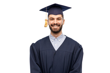 education, graduation and people concept - happy smiling male graduate student in mortar board and bachelor gown over white background