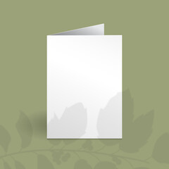 White vertical greeting card mockup template with holly berry branch with leaves overlay shadow.