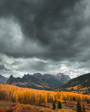 Scenic View Of Landscape Against Cloudy Sky During Autumn
