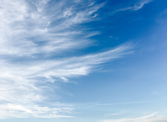 Naklejka na ściany i meble Blue sky with beautiful and fluffy white clouds