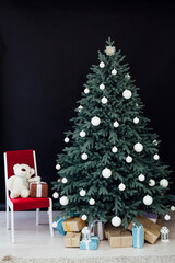 Christmas tree with presents underneath in living room