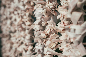 Fortune paper was tied at pole for a bad fortune from Japanese fortune telling strip. Osaka tenmangu shrine one of most important temple in Japan. close up view of hanging tied of omikuji in shinto