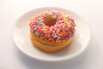  fresh donuts on plate on white background 