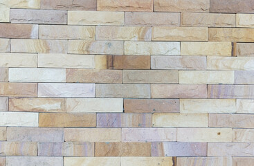 Beige brick wall background texture. Home and office design backdrop