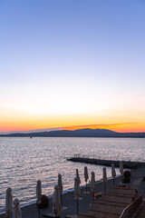 beautiful summer sunset on the shore of the sea bay
