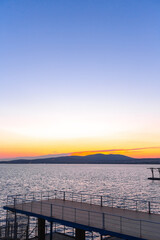 Fototapeta premium beautiful summer sunset on the shore of the sea bay