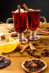Christmas magic atmosphere, home celebration. Hot mulled wine, spices and festive decorations. Winter holidays celebration concept