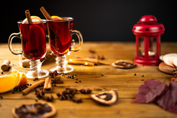 Christmas magic atmosphere, home celebration. Hot mulled wine, spices and festive decorations. Winter holidays celebration concept