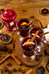 Christmas magic atmosphere, home celebration. Hot mulled wine, spices and festive decorations. Winter holidays celebration concept
