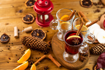 Christmas magic atmosphere, home celebration. Hot mulled wine, spices and festive decorations. Winter holidays celebration concept