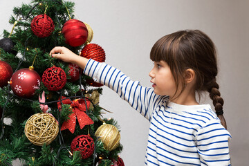 Girl Decorating The Christmas Tree