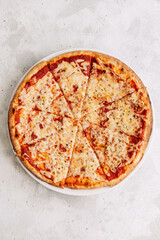 Pizza with parmesan cheese and tomato sauce