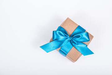 Gift box with satin bow on white background