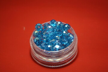 Blue beads in a box.