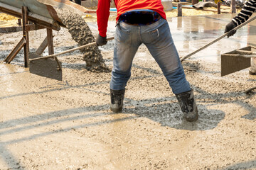 Concreters adjusting the concrete floor.