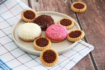 square sweet cookies and round marshmallows with sprinkles