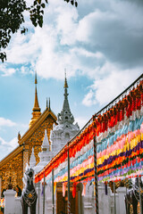 Fototapeta premium Wat Phrathat Haripunchai Woramahawihan during Loy Khratong lantern festival in Lamphun, Chiang Mai, Thailand