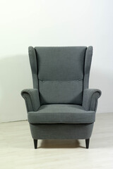 armchair with backrest stands on white background
