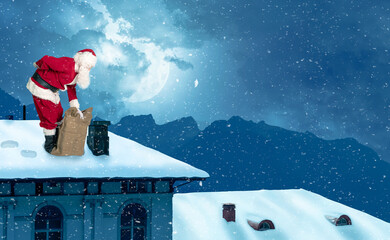 Santa stands with backache on a snow-covered roof in a winter landscape