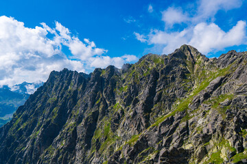 Clouds over the peaks of the High Tatras. View of the eagles trail. Poland. Orla Perć