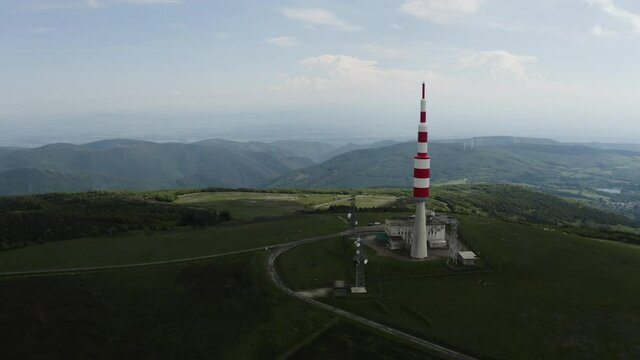 Big red and white Aerial on top of a mountain. Pic de Nore, sum of the black mountain, radar, parabol