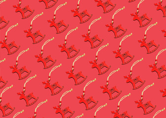 Christmas toy deer made of wood on a red background