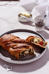 Swirl brioche with poppy seeds served with butter and jam. Poppy seed braided or roll bread, Babka. Traditional sweet Christmas bread