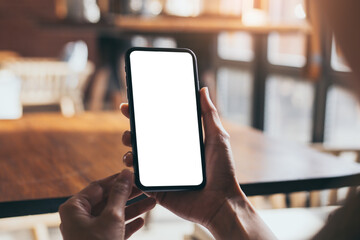 cell phone blank white screen mockup.woman hand holding texting using mobile on desk at office.background empty space for advertise.work people contact marketing business,technology