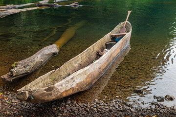 Traditional dugout canoe on a lake in Indonesia