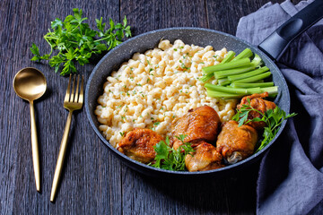 roast chicken thighs with pasta in a skillet