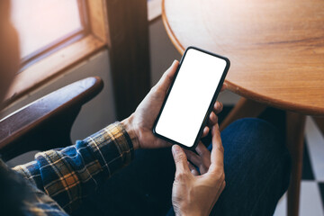 cell phone blank white screen mockup.woman hand holding texting using mobile on desk at office.background empty space for advertise.work people contact marketing business,technology