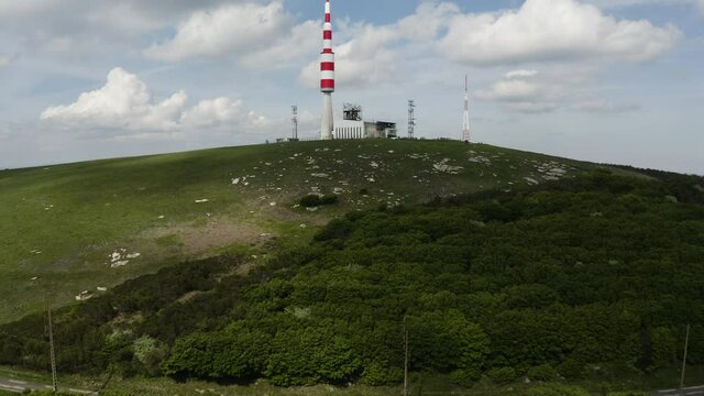 Big red and white Aerial on top of a mountain. Pic de Nore, sum of the black mountain, radar, parabol